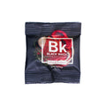 Black Black Magic seasoning packet on a white background