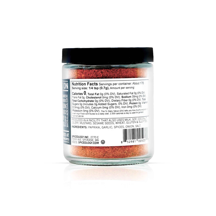 Back view of Spiceology black magic cajun blackening seasoning displaying nutrition facts and ingredient information.