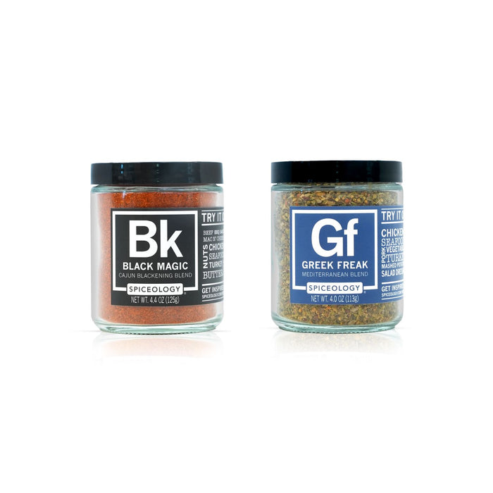 Two spice jars labeled 'Black Magic' and 'Greek Freak' on a white background