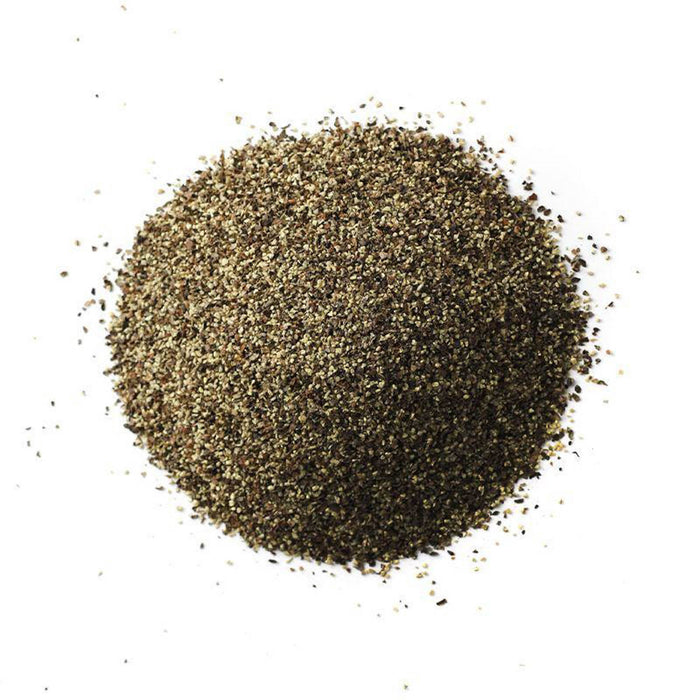 Closeup of small black and greenish granules