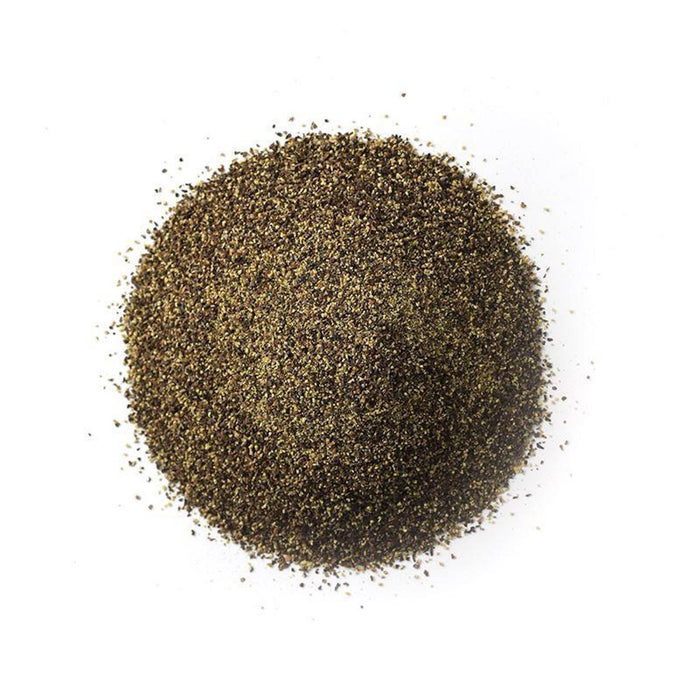 Closeup of small black and greenish granules