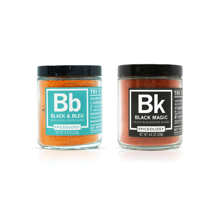 Two jars of spice mix, one labeled 'Black & Bleu' and the other 'Black Magic', on a white background.