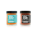 Two jars of spice mix, one labeled 'Black & Bleu' and the other 'Black Magic', on a white background.