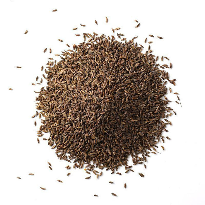 Closeup of small, crescent-shaped, grayish-brown seeds