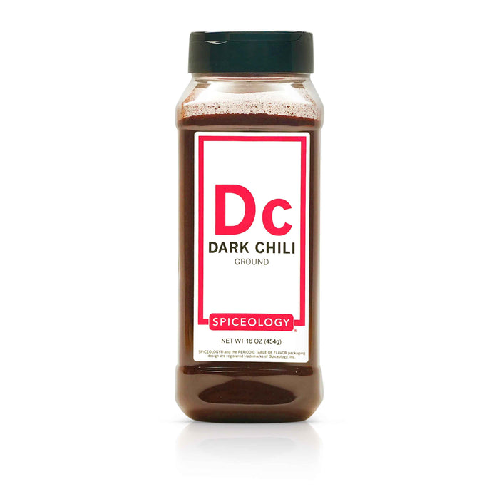 Bottle of Spiceology Dark Chili powder on a white background