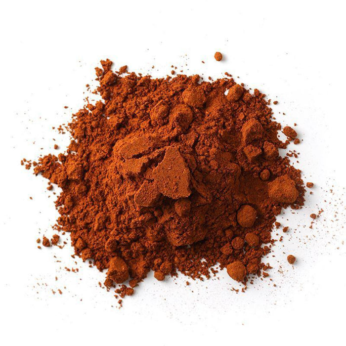 Closeup of deep reddish-brown powder