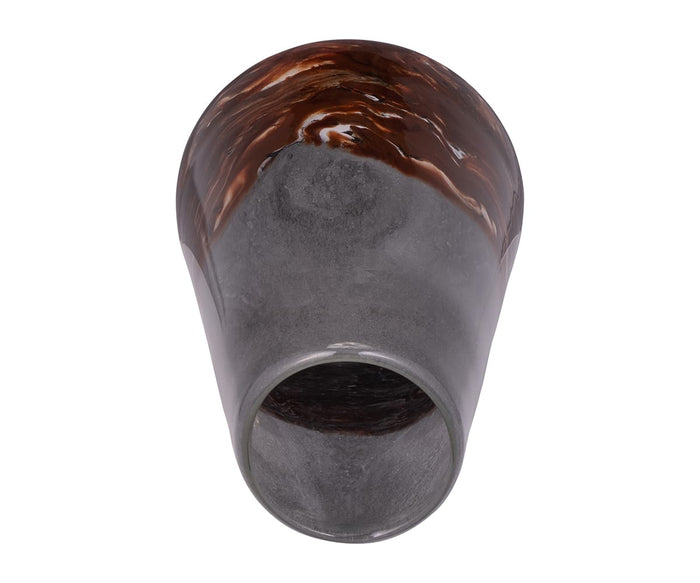The Copper Core Vase is a hand-finished glass piece with a gray marbled design, featuring a rounded base and wide opening. A glossy, dark brown marbled pattern accents the area near the top, adding elegance and contemporary style. Shown from above against a white background.