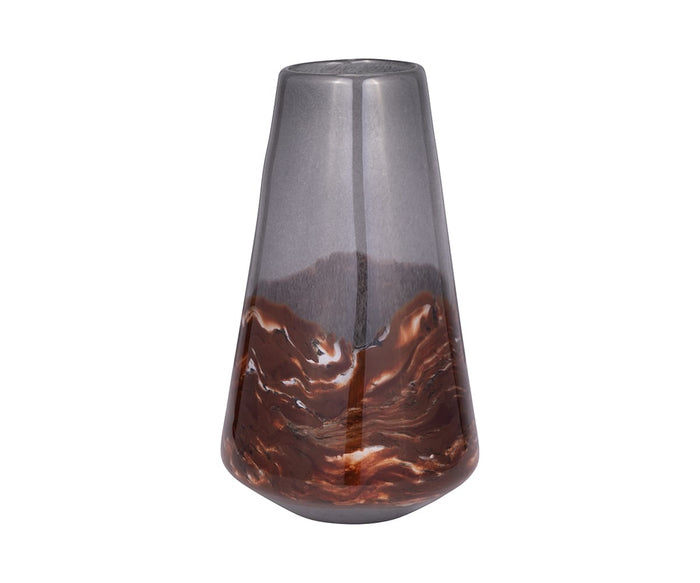 Sure! Here’s a revised version using your product data: The Copper Core Vase stands tall and striking, showcasing a glossy gray upper section and a hand-finished, marbled brown-and-white glass lower half—an elegant contrast set against white.