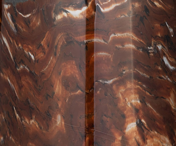 Close-up of the Copper Core Vase’s glossy, marbled brown surface, featuring hand-finished, wavy streaks in lighter and darker tones and a distinct vertical seam down the center—reminiscent of an artisanal glass marbled vase.