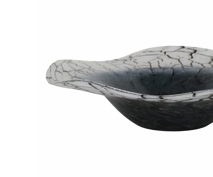 The Crackle Abstract Bowl is a hand-finished curved glass piece with a wide rim, showcasing a striking cracked black-and-white pattern on the exterior and a deep gradient interior for a modern matte look. It is presented here against a plain white background.
