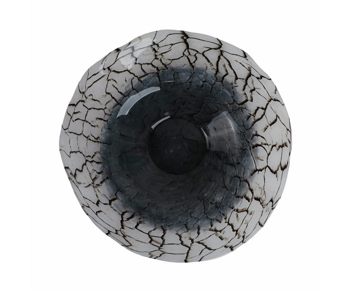 Top view of the Crackle Abstract Bowl, showcasing its round ceramic design with a glossy dark center and an eye-catching crackled white and black pattern that radiates outward, evoking the look of cracked ice or natural stone. The modern matte finish highlights its distinct, hand-finished glass-like appearance.