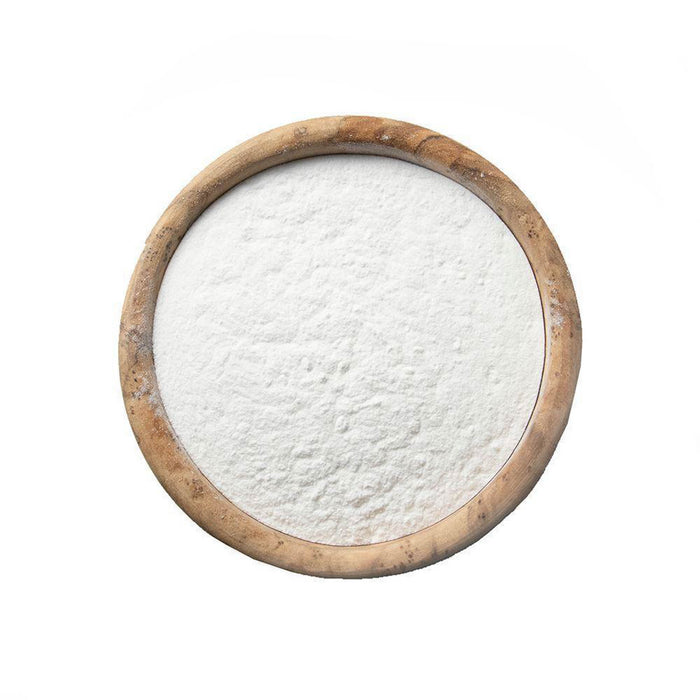 Closeup of white powder in a wooden bowl