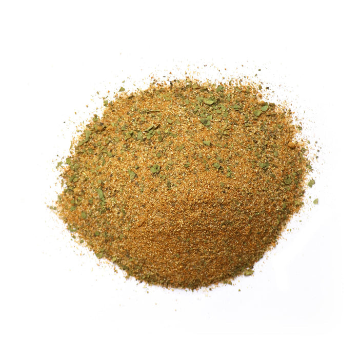 Closeup of yellow-brown granules with green flakes