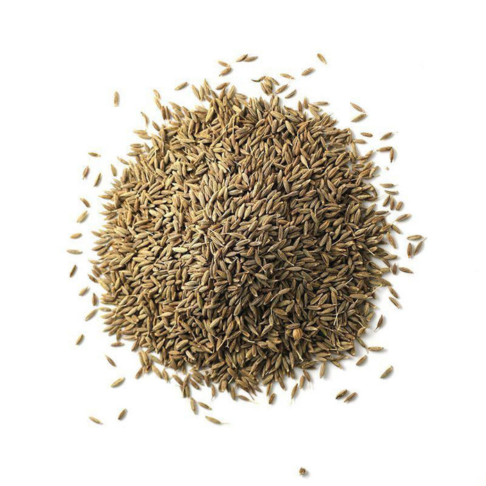 Closeup of light brown-green cumin seeds