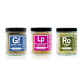 Three jars of Spiceology Everyday Bundle spice blends labeled Greek Freak, Pink Peppercorn Lemon Thyme and Rosemary Dijon on a white background