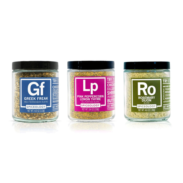 Three jars of Spiceology Everyday Bundle spice blends labeled Greek Freak, Pink Peppercorn Lemon Thyme and Rosemary Dijon on a white background