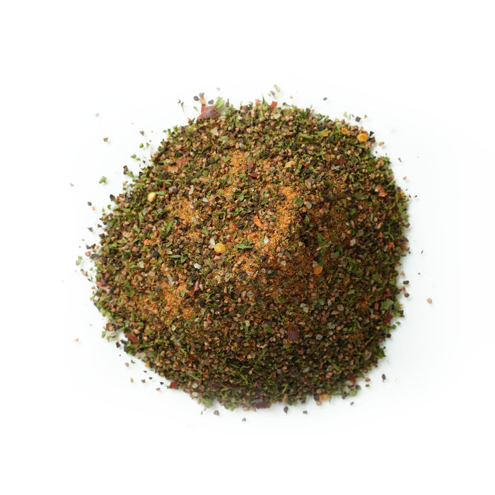 Close up of orange granules with green and red flakes