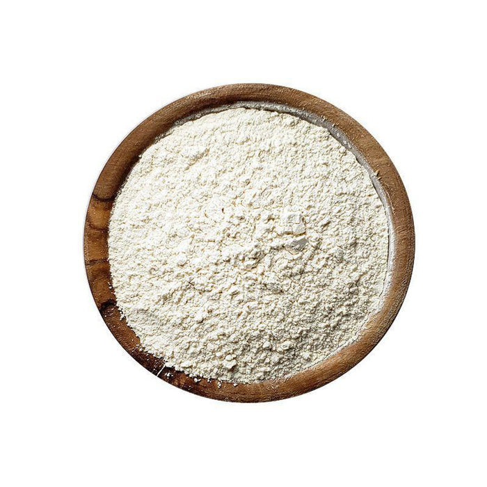 Closeup of white powder in a wooden bowl