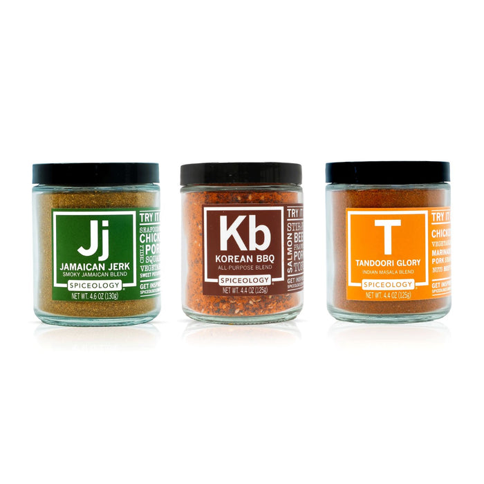 Three jars of Spiceology Global Bundle spice blends labeled Jamaican Jerk, Korean BBQ and Tandoori Glory on a white background