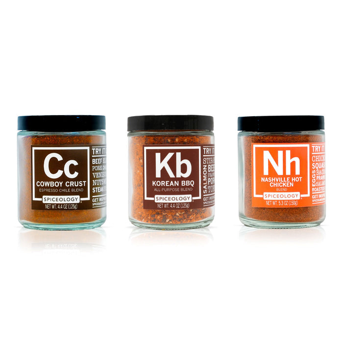 Three jars of Spiceology Grilling Bundle spice blends labeled Cowboy Crust, Korean BBQ and Nashville Hot Chicken on a white background