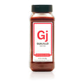 Bottle of Spiceology ground Guajillo Chile on a white background