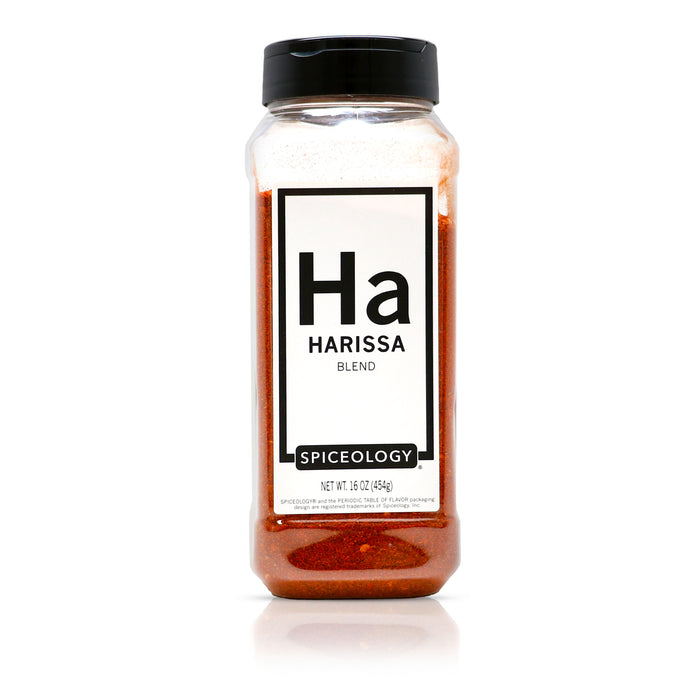 Bottle of Spiceology Harissa blend with a black lid on a white background