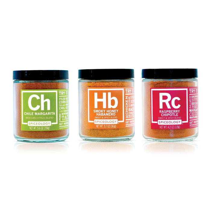 Three jars of Spicelogy spices  in the Latin Seasoning Bundle Chile Margarita, Smokey Honey Habanero and Raspberry Chipotle on a white background