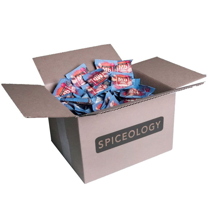 Cardboard box labeled 'Spiceology' filled with Maple Bourbon packets on a white background