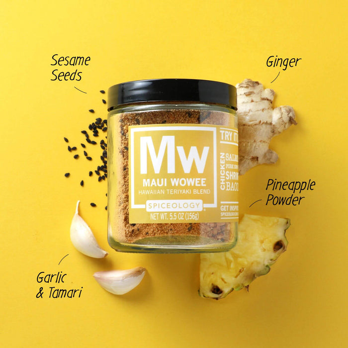 Spiceology Maui Wowee jar on a yellow background with labeled ingredient callouts for Sesame Seeds, Ginger, Pineapple Powder, Garlic, and Tamari surrounding the jar