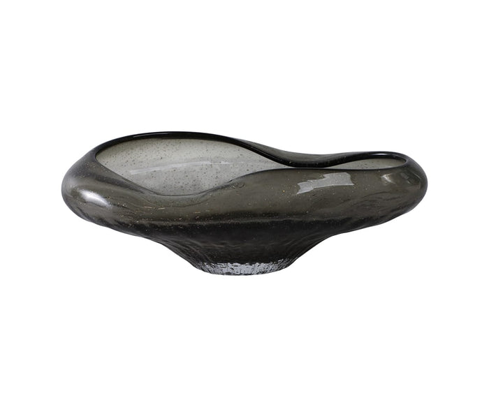 Hand-finished and featuring a glossy finish, the Midnight Wave Bowl is crafted from dark glass with an organic, asymmetrical silhouette, smooth curves, and a wide, shallow opening. This modern piece sits elegantly on a small round base, making it ideal for contemporary organic decor.