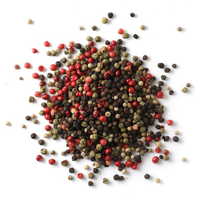 Closeup of red, green, black and white peppercorns mixed together