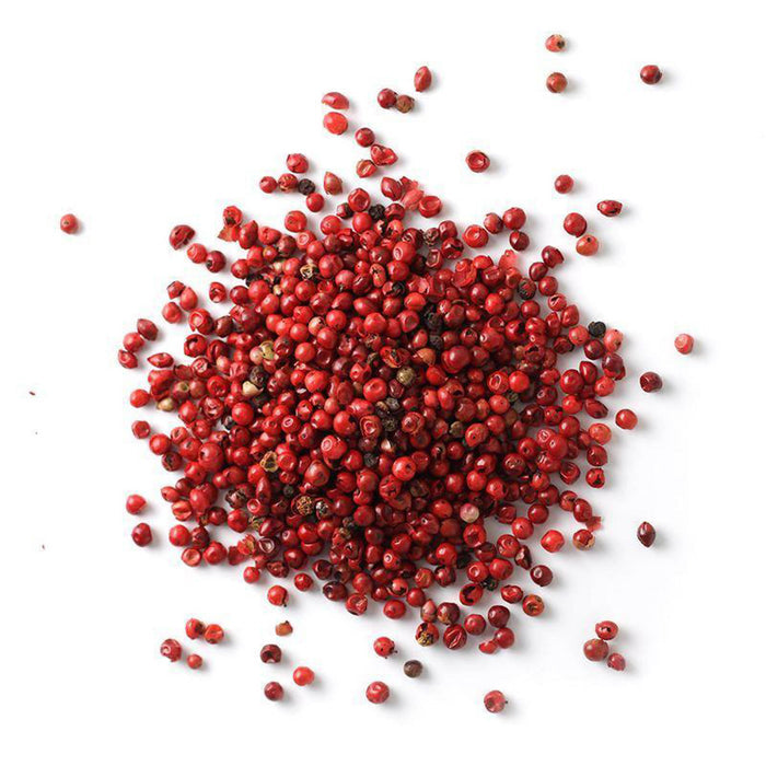 Closeup of dark pink peppercorns with dark red peppercorns mixed in
