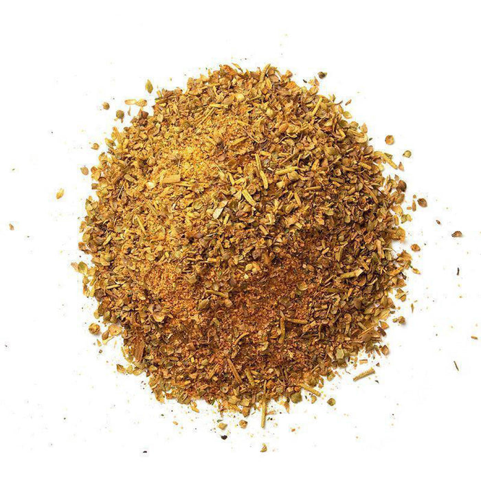 Closeup of light orange granules with dark tan/yellow flakes mixed in