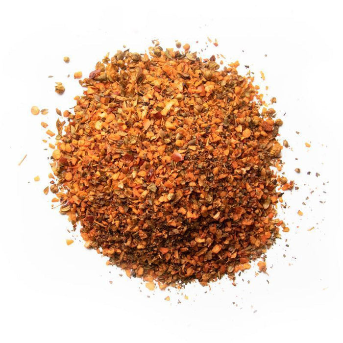 Closeup of orange, red and yellow large granules and flakes