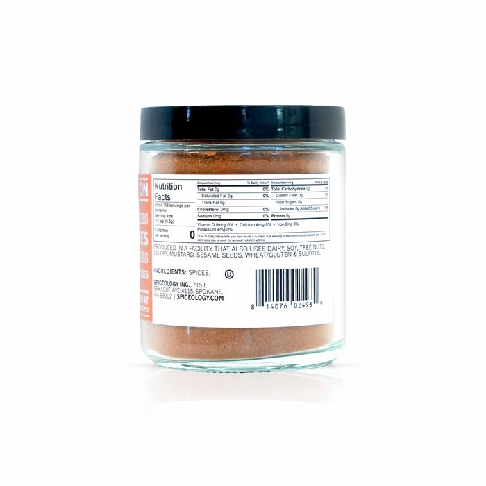 Back view of Spiceology pumpkin spice seasoning displaying nutrition facts and ingredient information.