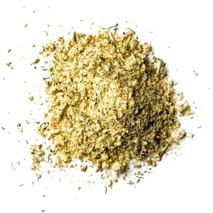 closeup of yellow powder with green flakes