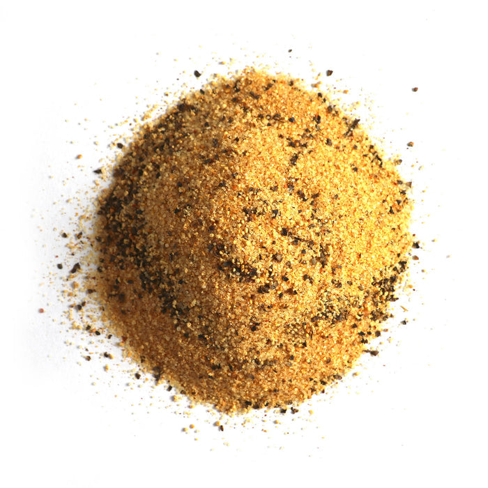 Closeup of golden yellow granules with black granules mixed in