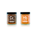 Two jars of spice mix, one labeled 'Cowboy Crust' and the other 'Smoky Honey Habanero', on a white background.