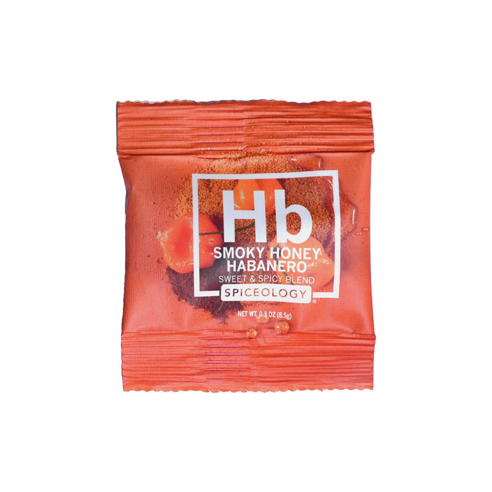 Orange Smokey Honey Habanero seasoning packet on a white background