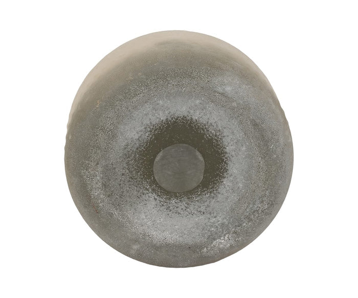A top-down view of the Soft Gradient Vase—a round, weathered gray vessel with a darker center—reveals a rough texture and subtle discoloration that evoke the hand-finished glass craftsmanship of artisanal pieces.
