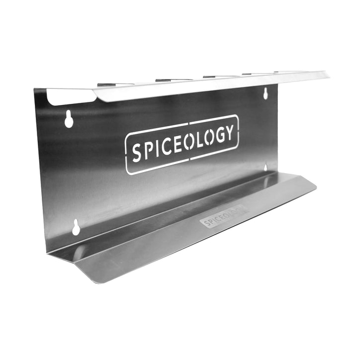 Metal spice rack with 'Spiceology' branding on a white background
