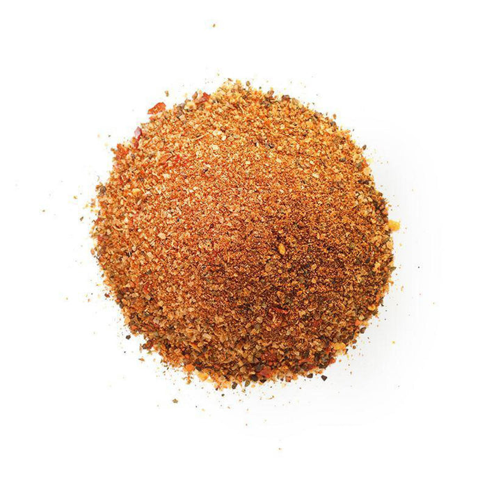 Closeup of orange granules with red flakes