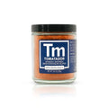 Jar of Tomatador spice blend with a blue label on a white background