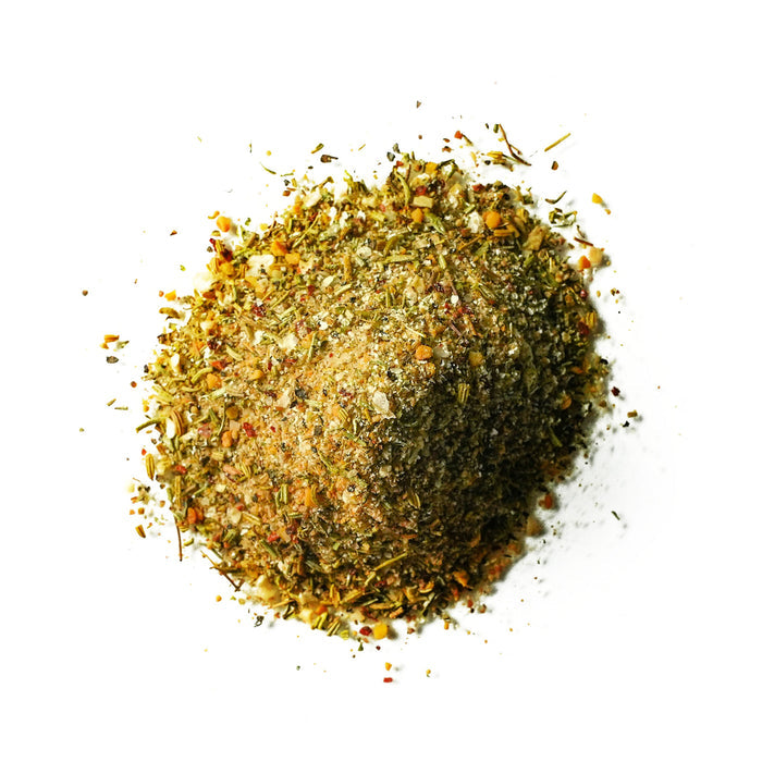 Closeup of yellow and green spices with red flakes mixed in