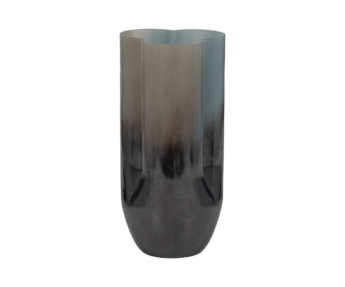 The Twilight Vase is a tall, cylindrical vessel meticulously crafted from hand-finished glass, showcasing a striking gradient transition from light gray at the top to dark gray at the base. Set against a white background, this contemporary vase introduces an effortless touch of modern elegance to any space.