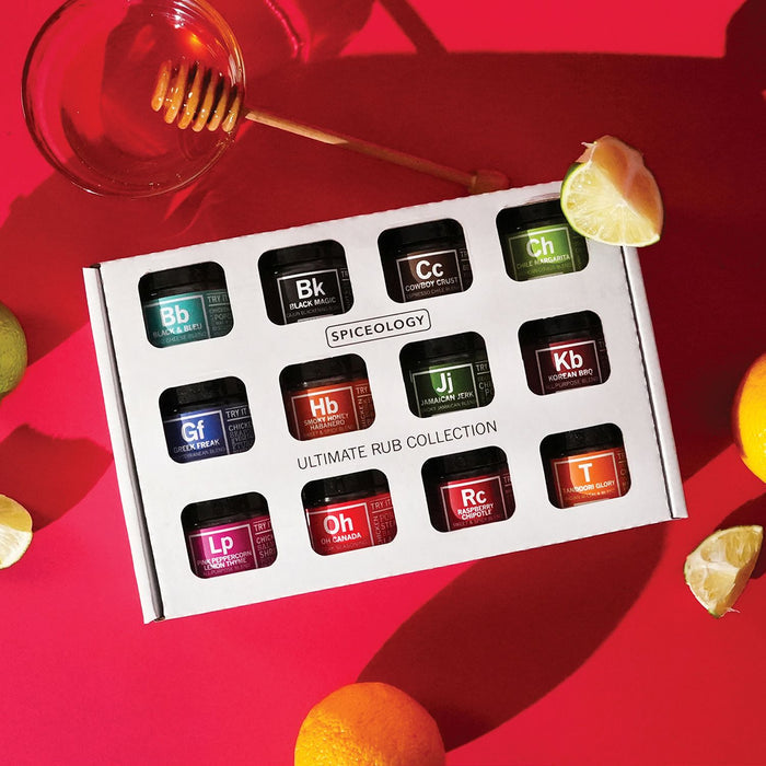 Spiceology Ultimate Rub Collection on a red background with lemons and honey.