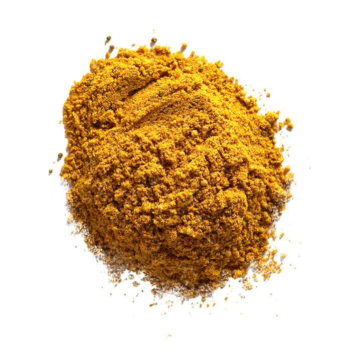 Closeup of a golden-yellow finely ground spice