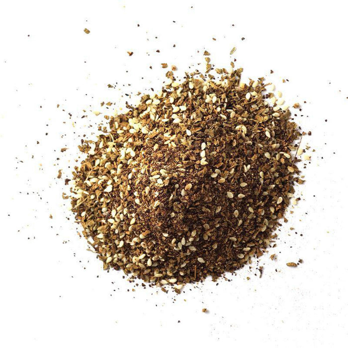 Closeup of a brown spice with white seeds